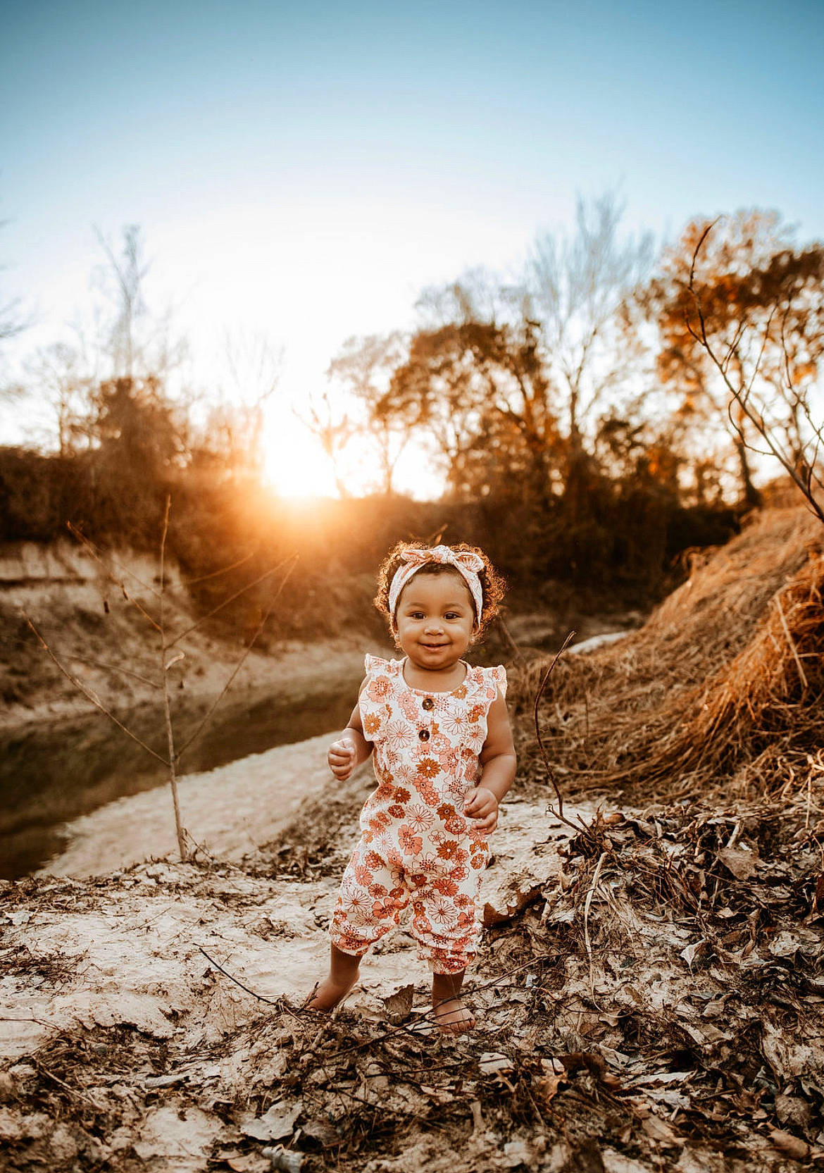 Alianna is registered to the contest to win money with this photo: dress, fawn, flash_photography, forest, grass, grass_family, grassland, happy, joy, landscape, leaf, people_in_nature, person, plant, rural_area, sky, standing, sunlight, tints_and_shades, toddler