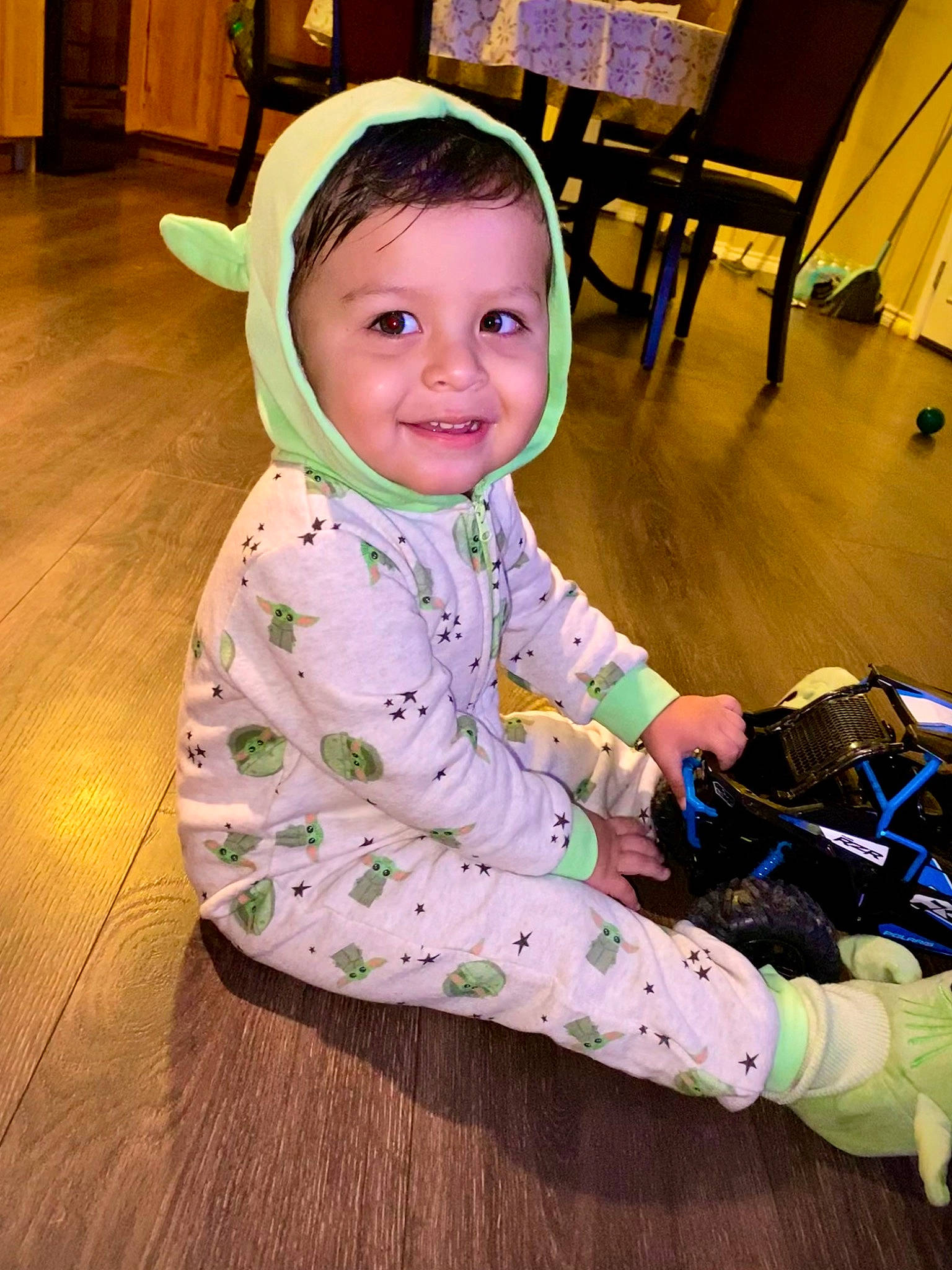 Evel Roberto is registered to the contest to win money with this photo: baby, baby_toddler_clothing, chair, child, event, floor, flooring, fun, happy, hardwood, joy, leisure, pattern, person, play, room, sitting, skin, sleeve, smile