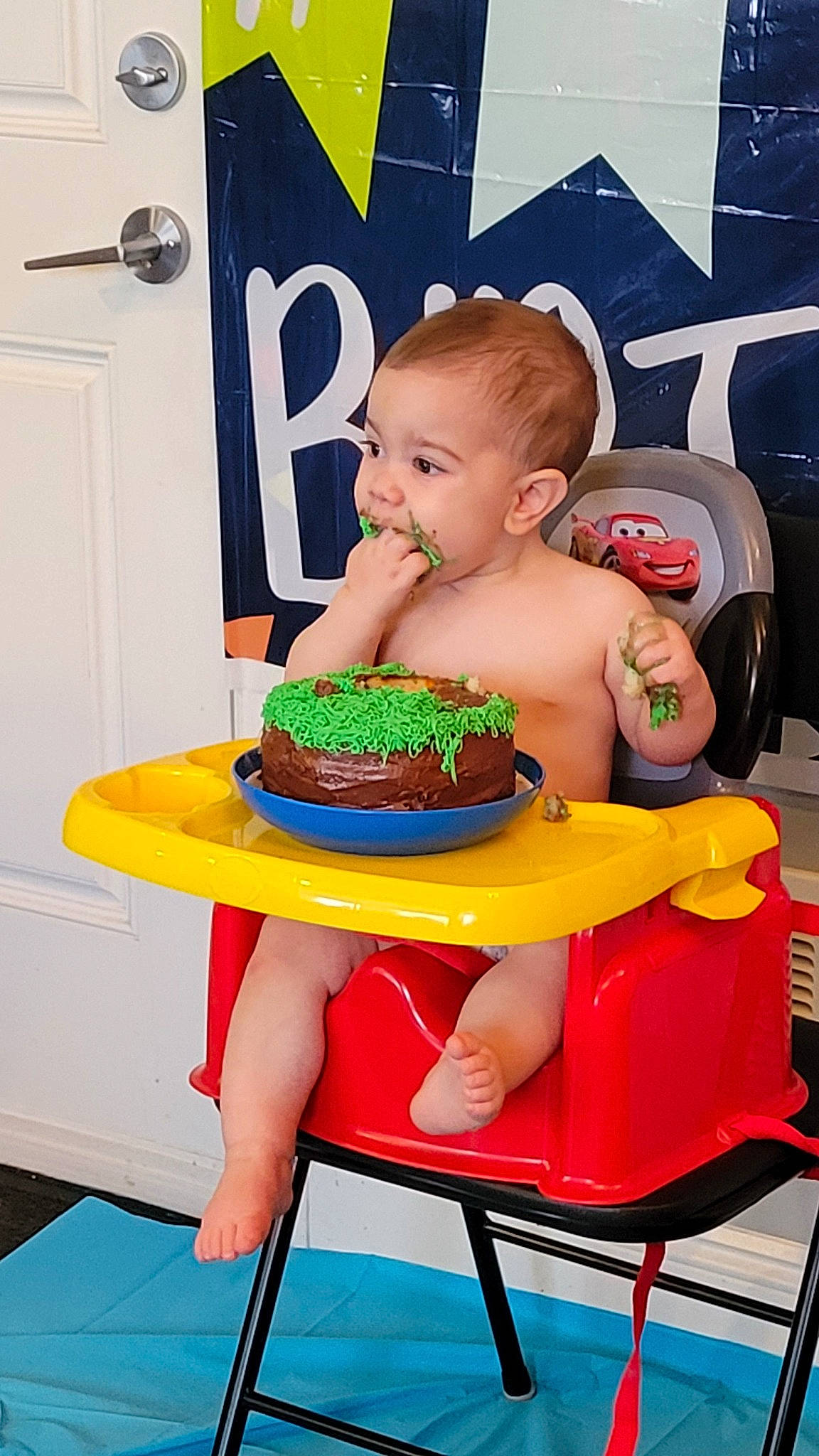 Garrett joined the competition — help win amazing prizes! baby, baby_toddler_clothing, baked_goods, baking, birthday_cake, cake, cake_decorating, cake_decorating_supply, chair, child, dessert, food, icing, junk_food, orange, person, sitting, sweetness, table, tableware