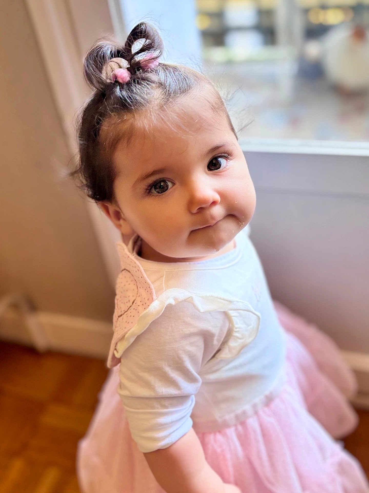 Lilyana a rejoint le concours — aidez-le/la à gagner de superbes lots ! toddler, child, girl, indoor, window, pink_tutu, white_top, hair_bow, curly_hair, portrait, cute, soft_light, floor, wooden_floor, face, eyes, expression, clothing, person, baby
