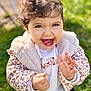 Lilyana a rejoint le concours — aidez-le/la à gagner de superbes lots ! toddler, child, smiling, happy, clapping, outdoor, grass, jacket, leopard_print, white_shirt, cute, portrait, face, hands, baby, sunlight, nature, expression, joy, warm_clothing