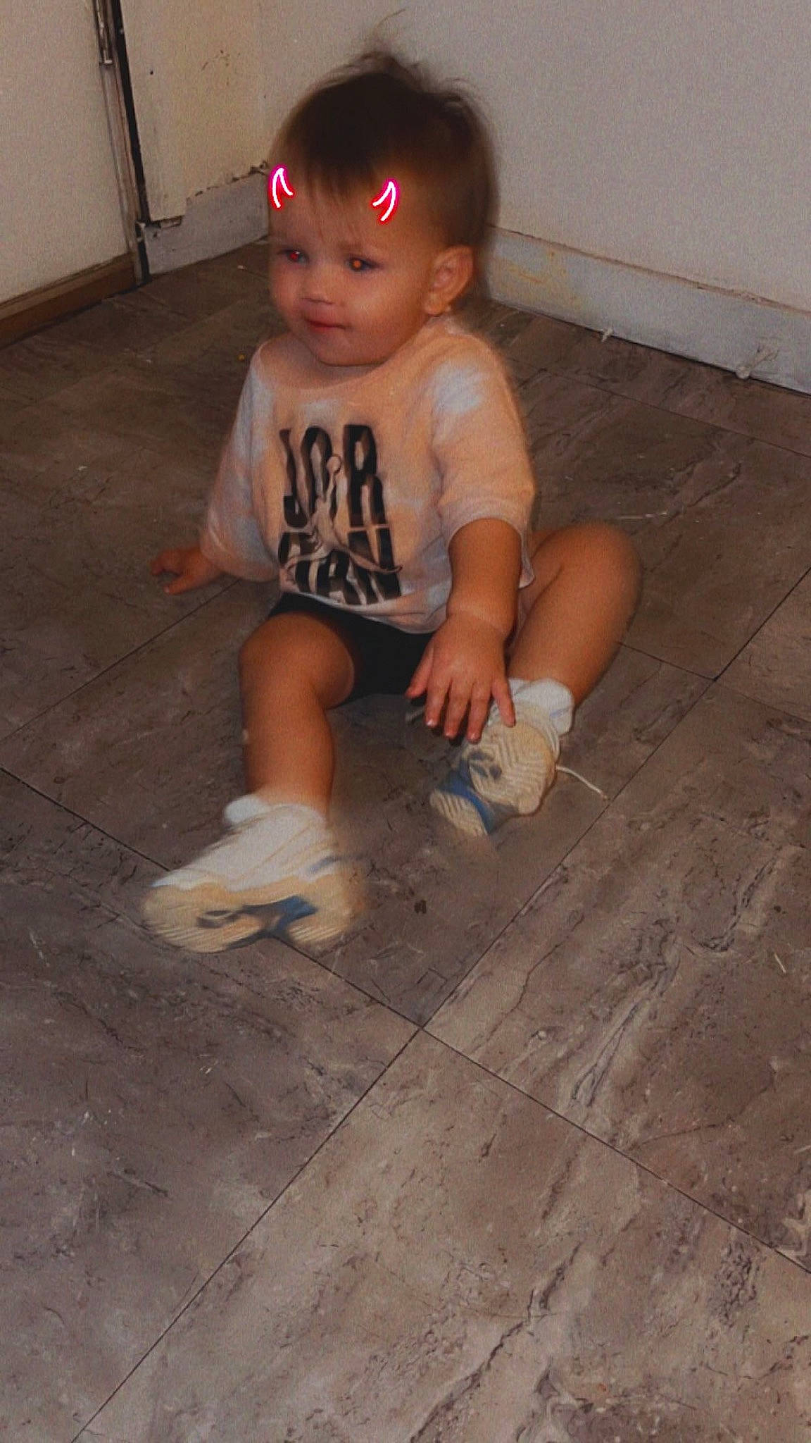 Skyler is registered to the contest to win money with this photo: baby, baby_toddler_clothing, barefoot, child, flooring, foot, fun, hardwood, head, human_leg, knee, person, road_surface, sandal, sitting, smile, soil, thigh, thumb, toddler