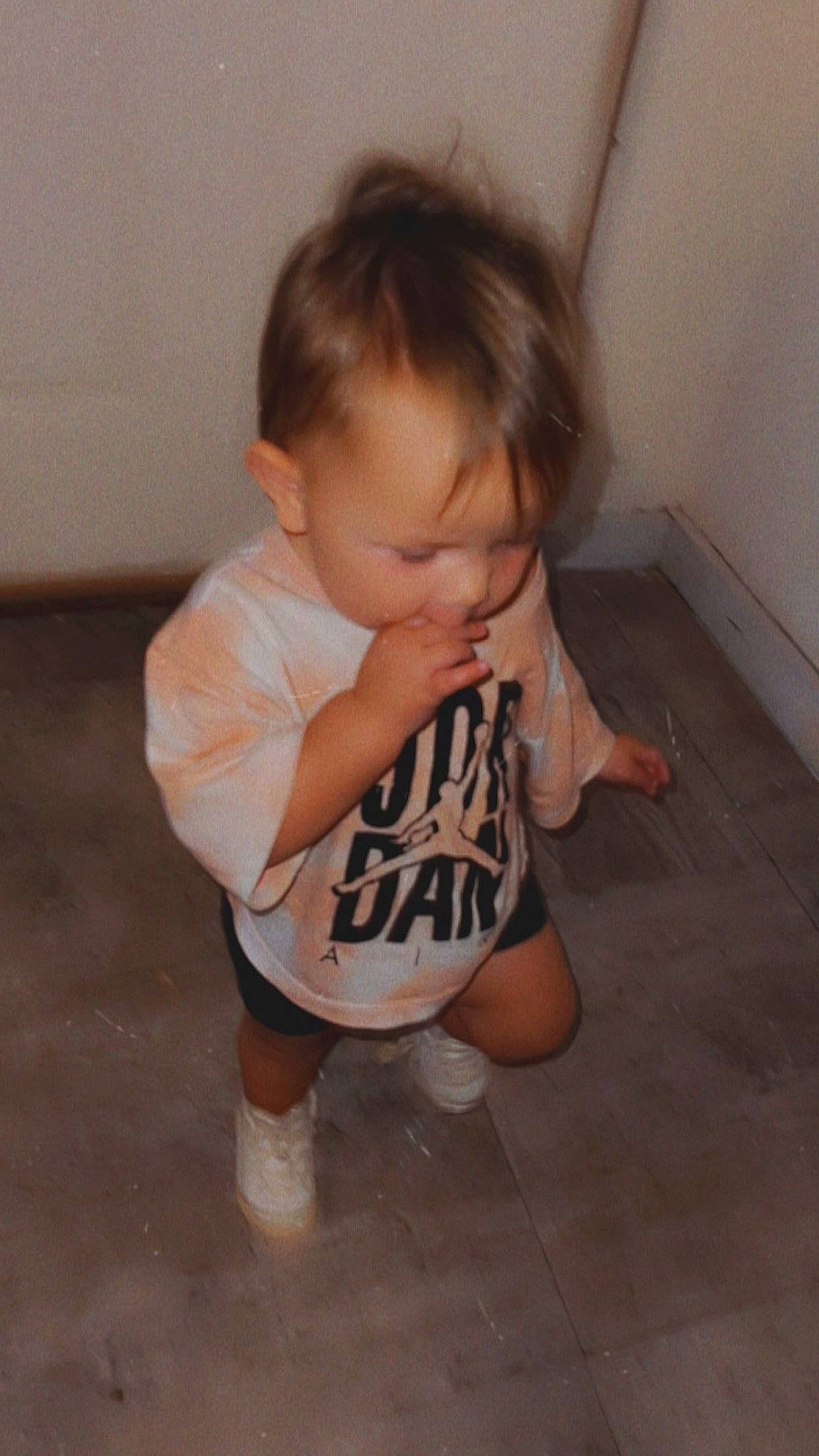 Skyler joined the competition — help win amazing prizes! baby, baby_toddler_clothing, cheek, face, floor, flooring, foot, hardwood, head, human_leg, knee, neck, nose, person, sitting, sleeve, t_shirt, thigh, toddler, trunk