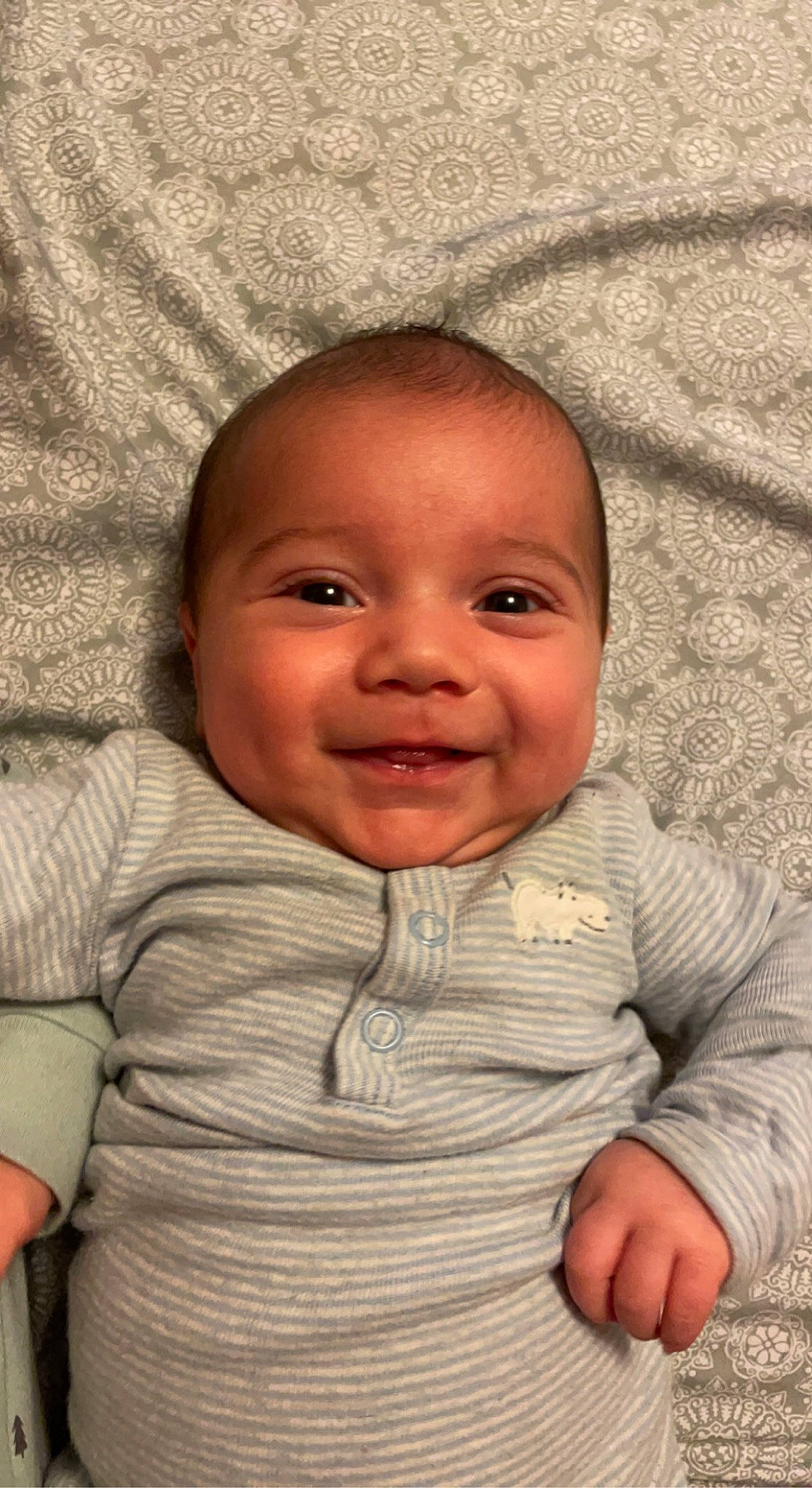 Tucker is registered to the contest to win money with this photo: baby_toddler_clothing, cheek, chin, comfort, eye, eyebrow, finger, gesture, hair, hairstyle, hand, happy, human_body, iris, joy, lip, mouth, nose, person, skin