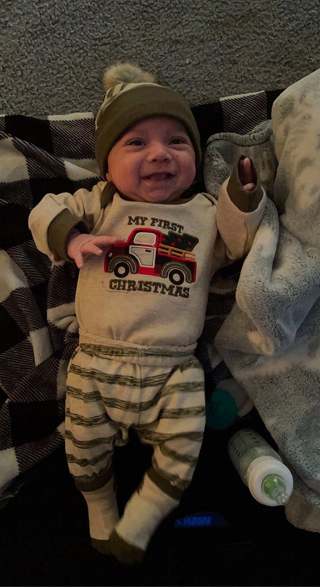 Tucker joined the competition — help win amazing prizes! arm, baby, baby_toddler_clothing, cap, child, comfort, cool, facial_expression, gesture, grass, happy, head, headwear, joy, leaf, outerwear, person, sleeve, smile, standing