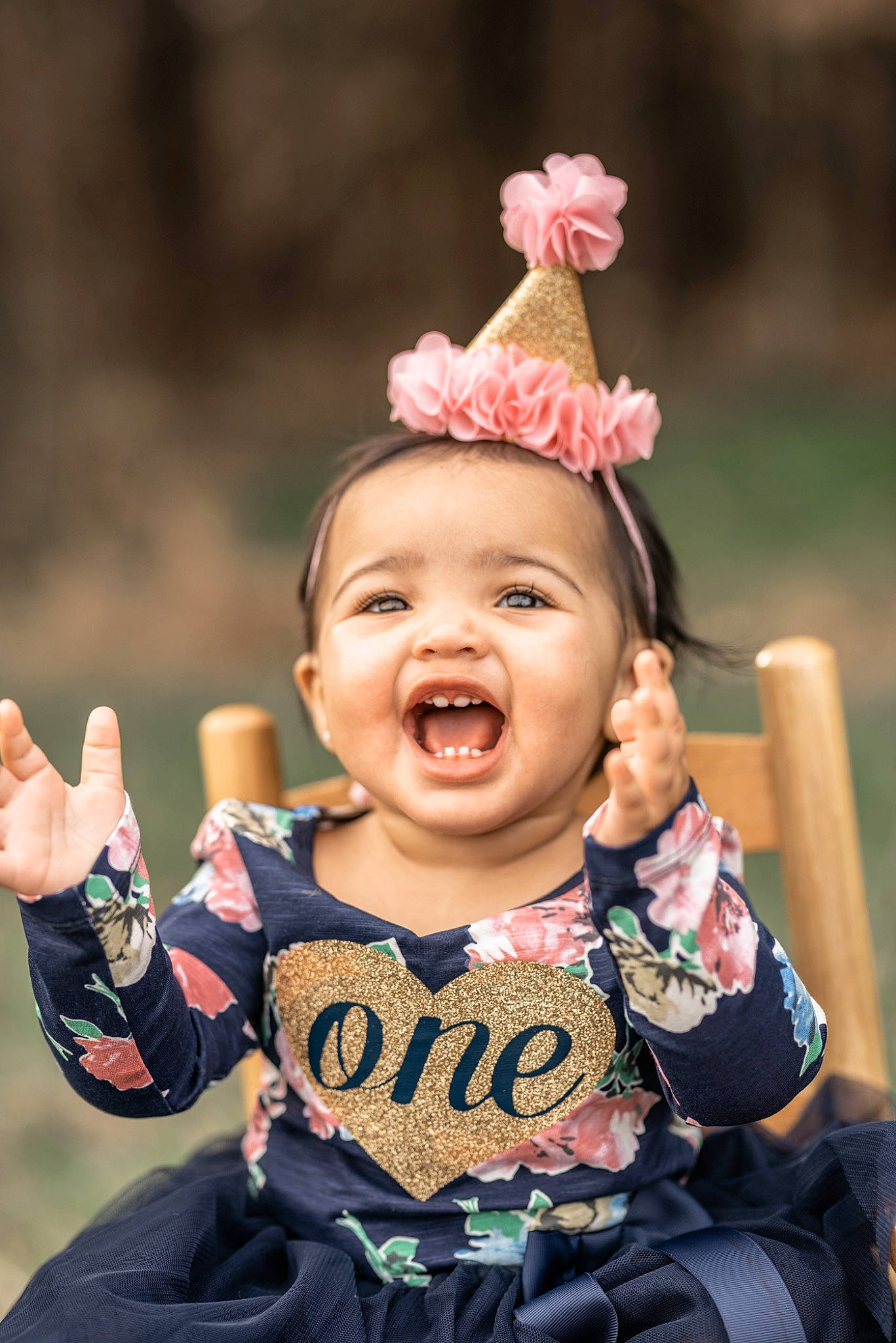 Aubri is registered to the contest to win money with this photo: baby, child, child_model, ear, facial_expression, fashion_accessory, fun, gesture, hair_accessory, hand, happy, headgear, laugh, people, person, photography, pink, portrait_photography, smile, toddler
