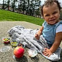 Naomi joined the competition — help win amazing prizes! apple, baby, backyard, face, food, fruit, grass, head, nature, outdoors, park, person, photography, plant, portrait, produce, sitting, summer, tree, yard