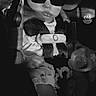 Shyanne is registered to the contest to win money with this photo: baby, car_seat, sunglasses, child, infant, seatbelt, pacifier, toy, monochrome, black_and_white, cute, portrait, child_safety, clothing, seat, baby_gear, hands, legs, expression, accessory