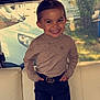 Denver participe au concours pour gagner de l'argent avec cette photo : child, smiling, standing, indoor, window, sweater, pants, belt, hair, face, person, happy, young, confident, casual_clothing, vehicle_interior, sunlight, background, nature, seat