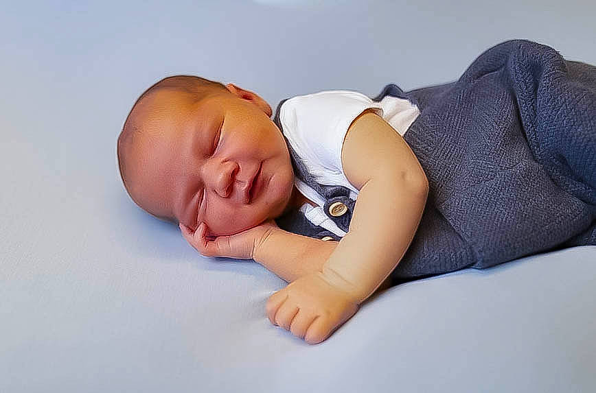 Casen is registered to the contest to win money with this photo: baby, baby_products, baby_sleeping, baby_toddler_clothing, bedtime, cheek, child, comfort, fashion_accessory, flash_photography, happy, headgear, human_body, linens, nap, person, portrait_photography, sitting, skin, toddler