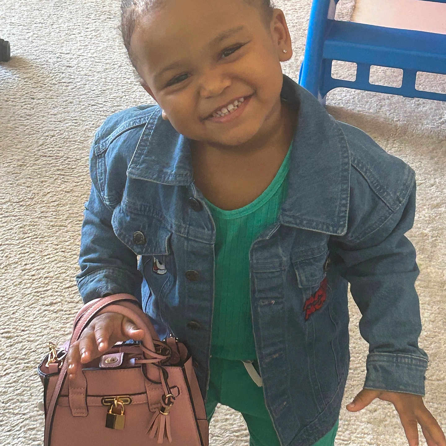Melody is registered to the contest to win money with this photo: accessories, bag, child, clothing, coat, face, female, girl, glove, handbag, happy, head, jacket, jeans, pants, person, photography, portrait, purse, smile