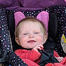 Rilynn joined the competition — help win amazing prizes! baby, infant, child, smiling, portrait, car_seat, harness, polka_dots, pink, red_clothing, seated, indoor, close_up, face, eyes, hair, happy, vehicle_interior, padded_seat, photograph