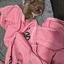 Malo participe au concours pour gagner de l'argent avec cette photo : puppy, dog, sleeping, blanket, pink_hoodie, toy, cozy, cute, small, fur, indoor, soft, resting, pet, animal, clothing, fabric, relaxed, adorable, napping