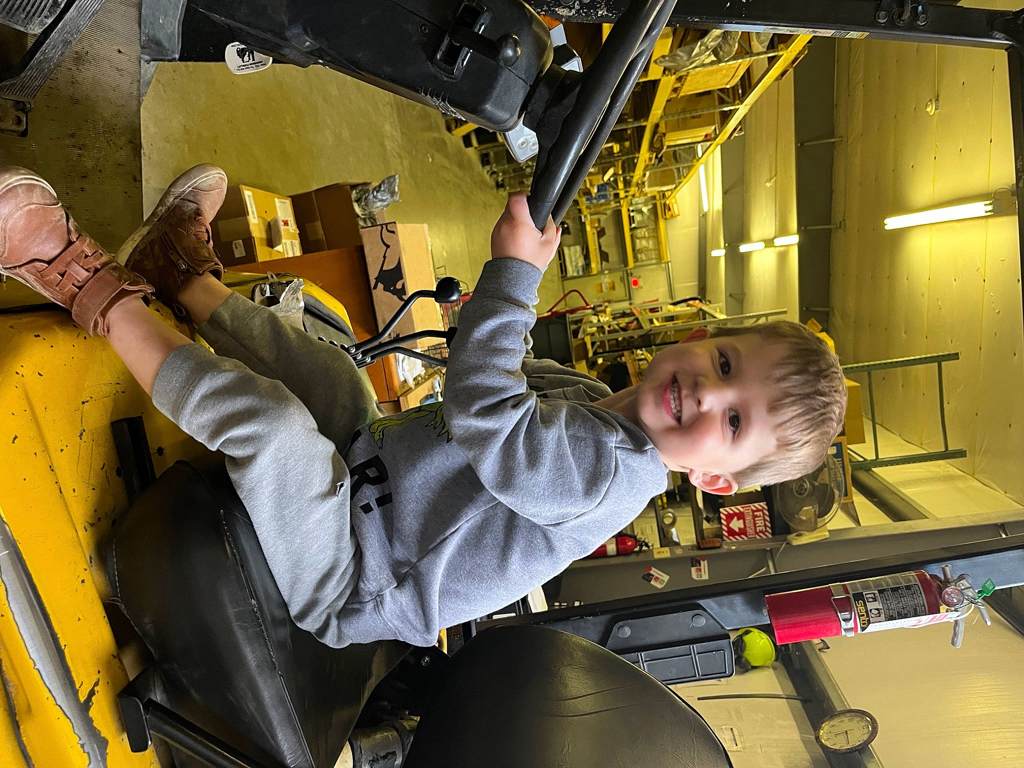 D.j is registered to the contest to win money with this photo: aerospace_engineering, auto_part, automotive_design, automotive_exterior, automotive_tire, automotive_wheel_system, engineering, fun, helmet, joy, leisure, machine, motor_vehicle, person, personal_protective_equipment, recreation, smile, space, tire, toddler