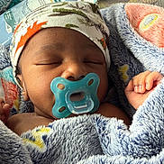 Kairo joined the competition — help win amazing prizes! baby, sleeping, pacifier, blanket, hat, infant, cozy, cute, resting, hand, face, home, fabric, pattern, tissue, couch, soft, child, wrapped, peaceful