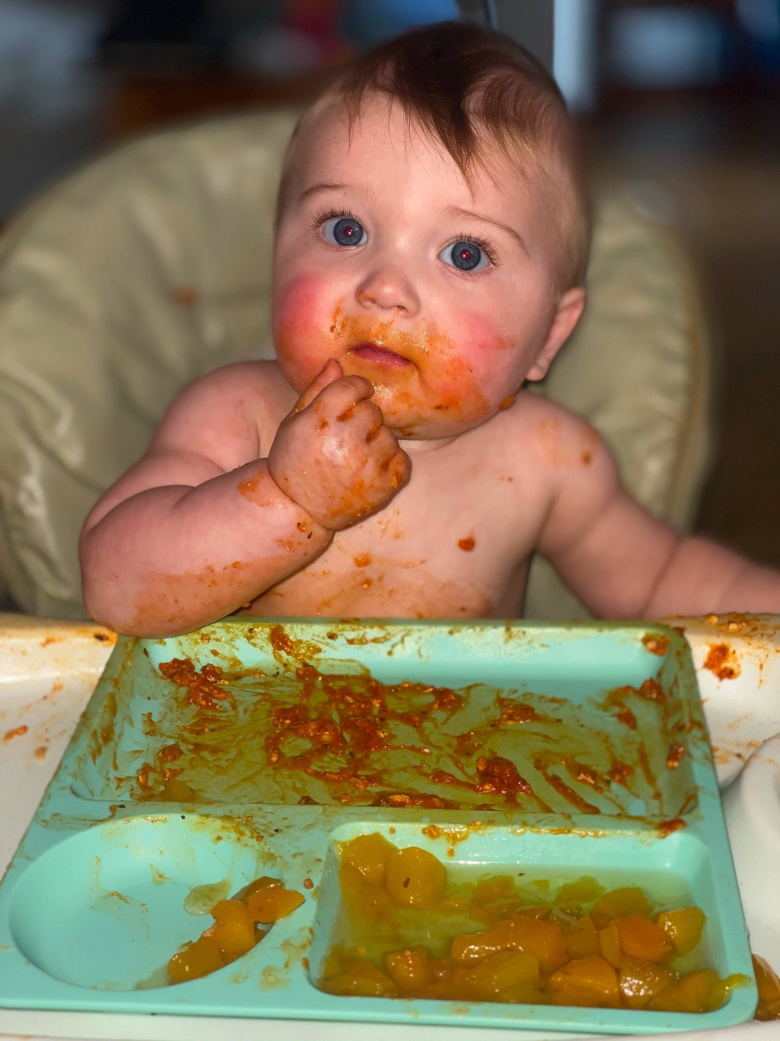 Cade is registered to the contest to win money with this photo: baby, baby_food, chair, child, comfort_food, cuisine, dish, dress, event, food, food_craving, fruit, green, happy, junk_food, person, plate, sweetness, tableware, toddler