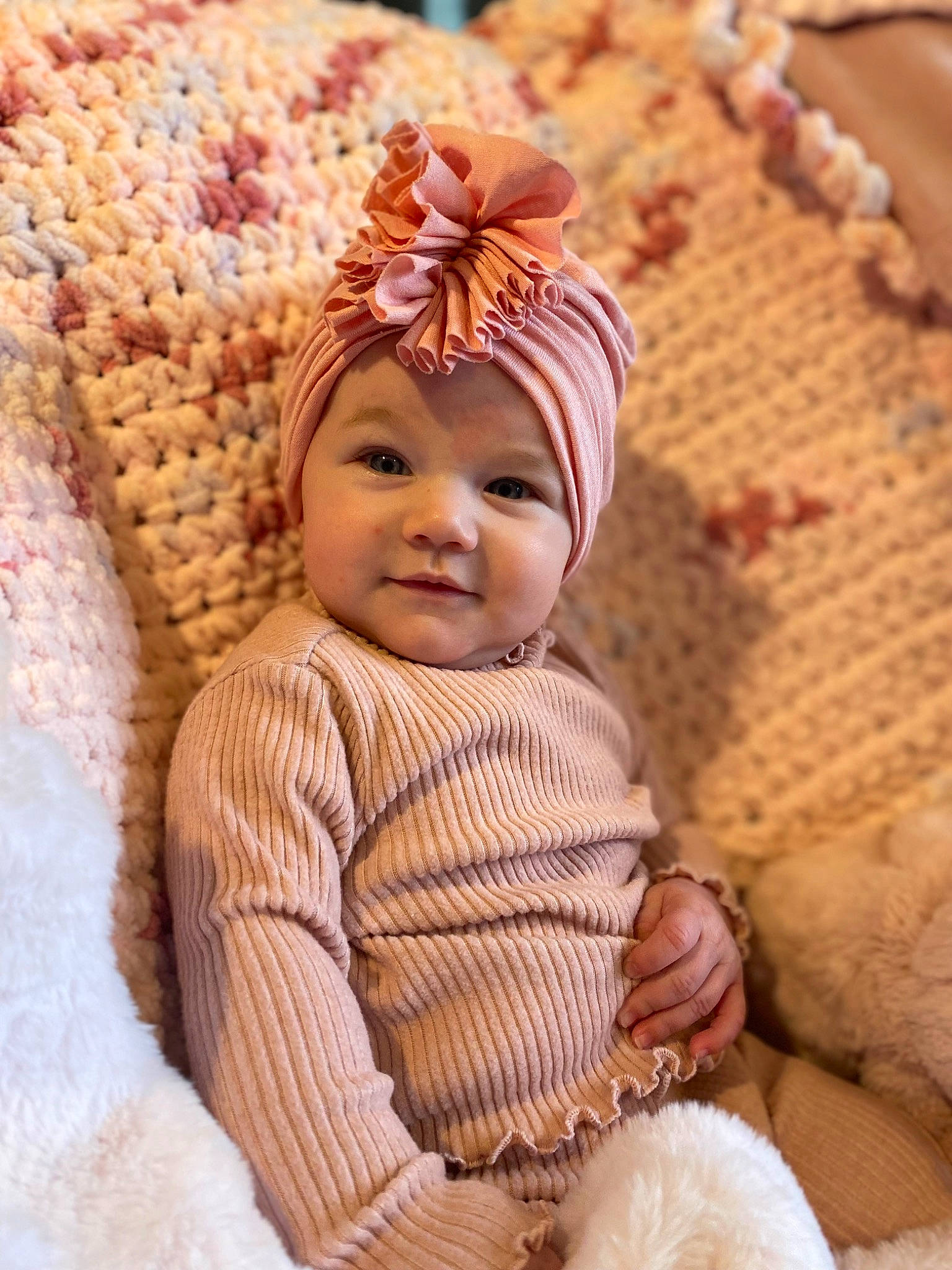 Sadie joined the competition — help win amazing prizes! baby, baby_toddler_clothing, beanie, cap, child, eye, fashion_accessory, hair_accessory, happy, headband, headgear, headwear, joy, knit_cap, linens, peach, person, sleeve, smile, textile