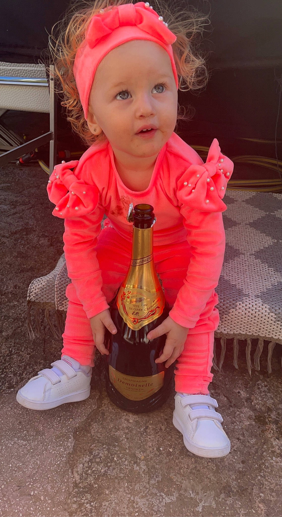 Ezra participe au concours pour gagner de l'argent avec cette photo : baby_toddler_clothing, cap, child, eye, face, fun, grass, happy, head, headwear, jacket, people, person, pink, product, shoe, sleeve, smile, standing, toddler