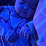 baby, sleeping_baby, infant, child, asleep, pajamas, blanket, pillow, hand, face, portrait, closeup, head, cozy, cute, peaceful, night_light, blue_tint, bedding, nursery