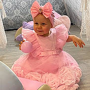 Esmae-Rose joined the competition — help win amazing prizes! toddler, child, pink_dress, headband, bow, ball, smiling, indoor, cushion, floor, lace, decor, playful, cute, girl, soft_lighting, portrait, happy, seated, baby