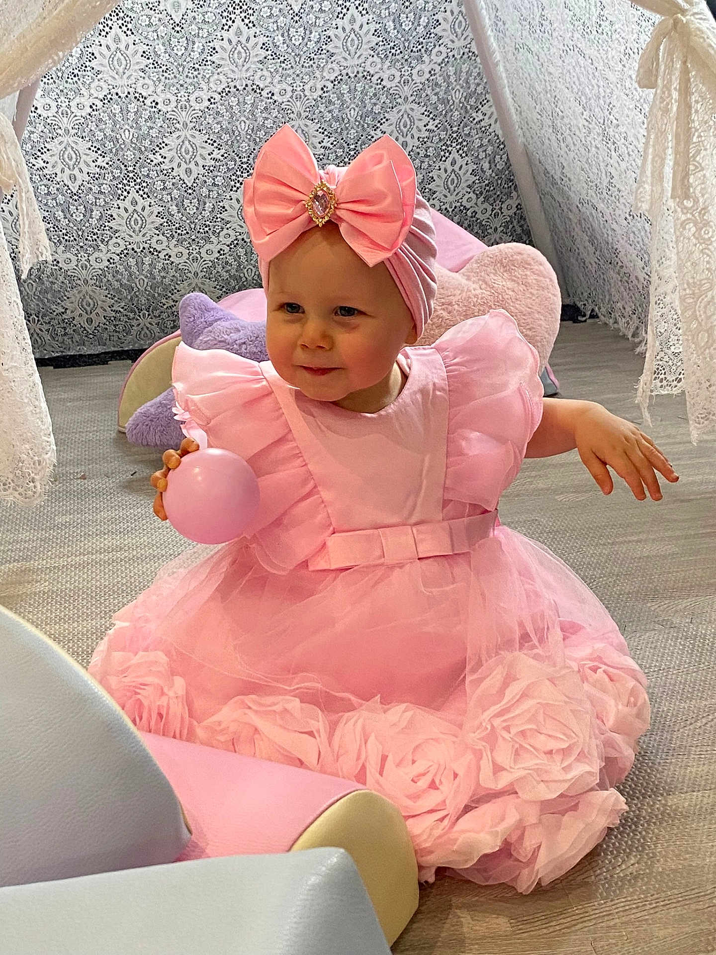 Esmae-Rose joined the competition — help win amazing prizes! toddler, child, pink_dress, headband, bow, ball, smiling, indoor, cushion, floor, lace, decor, playful, cute, girl, soft_lighting, portrait, happy, seated, baby