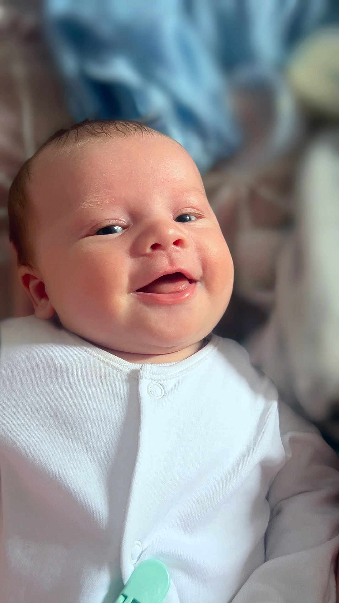 Sonny joined the competition — help win amazing prizes! baby, infant, smiling, face, white_clothing, portrait, closeup, cute, child, happy, skin, head, eyes, mouth, indoors, newborn, expression, human, soft_light, peaceful