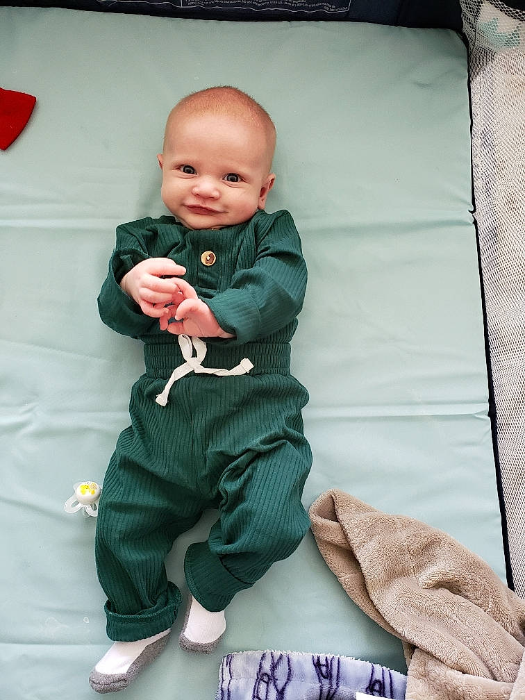 Everest joined the competition — help win amazing prizes! baby, baby_toddler_clothing, carmine, child, comfort, formal_wear, joy, linens, outerwear, pattern, person, pillow, pink, room, sitting, sleeve, smile, sock, standing, t_shirt