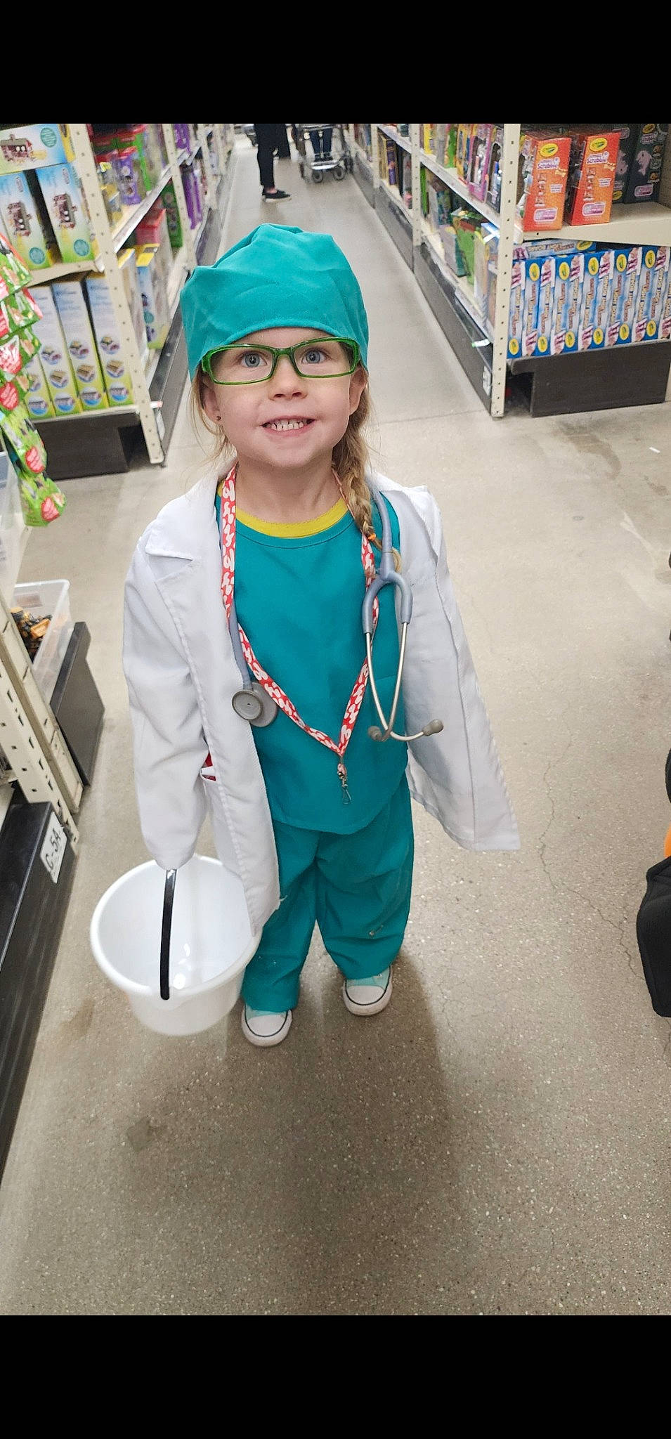 Raegan joined the competition — help win amazing prizes! baseball_cap, cap, child, costume, electric_blue, event, eyewear, fashion_accessory, fun, headgear, headwear, jewellery, joy, person, personal_protective_equipment, room, sleeve, smile, toddler, uniform