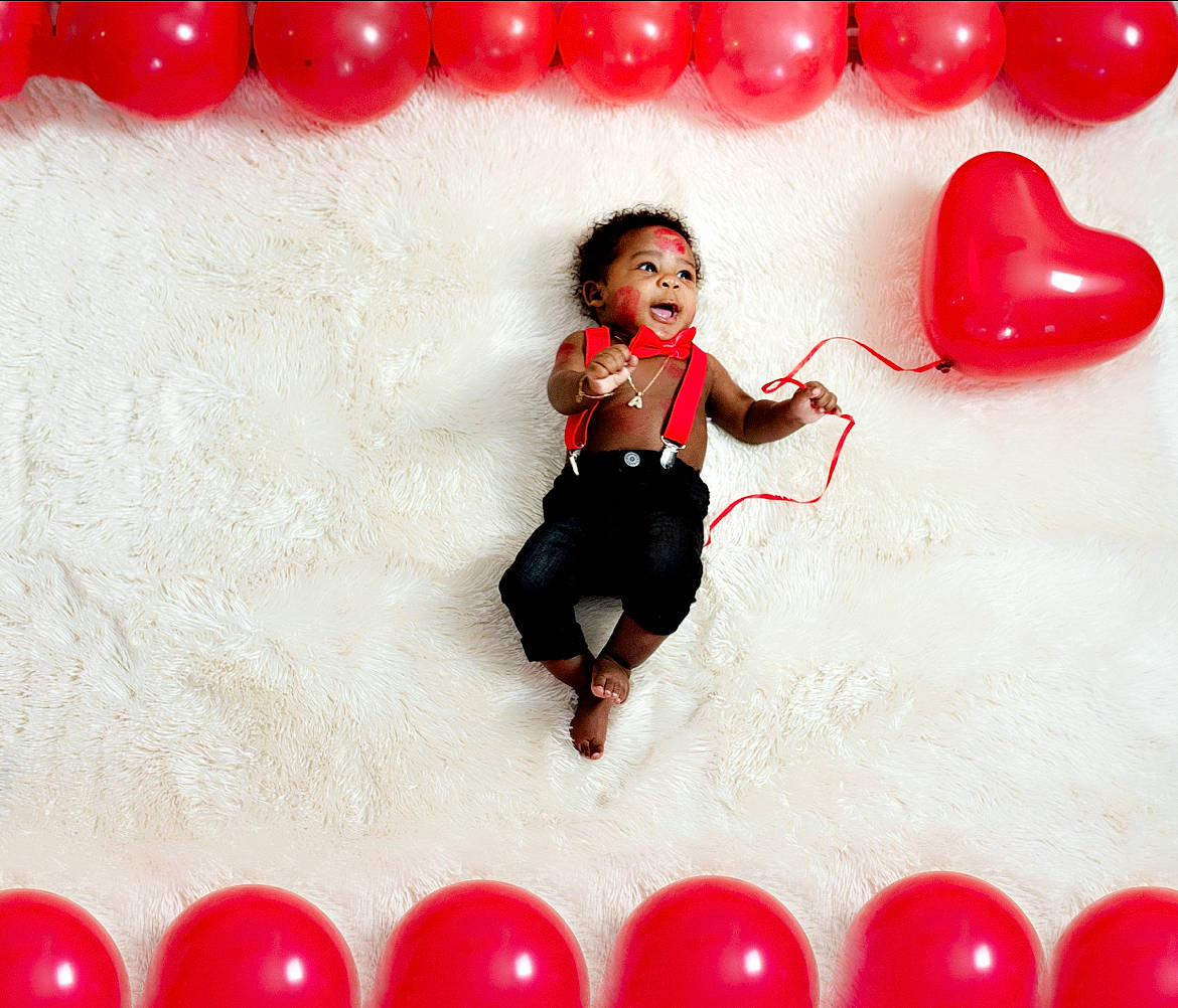 Aston joined the competition — help win amazing prizes! carmine, child, event, flooring, font, fun, gesture, happy, love, magenta, organ, party_supply, pattern, person, photograph, photography, red, sleeve, snapshot, white