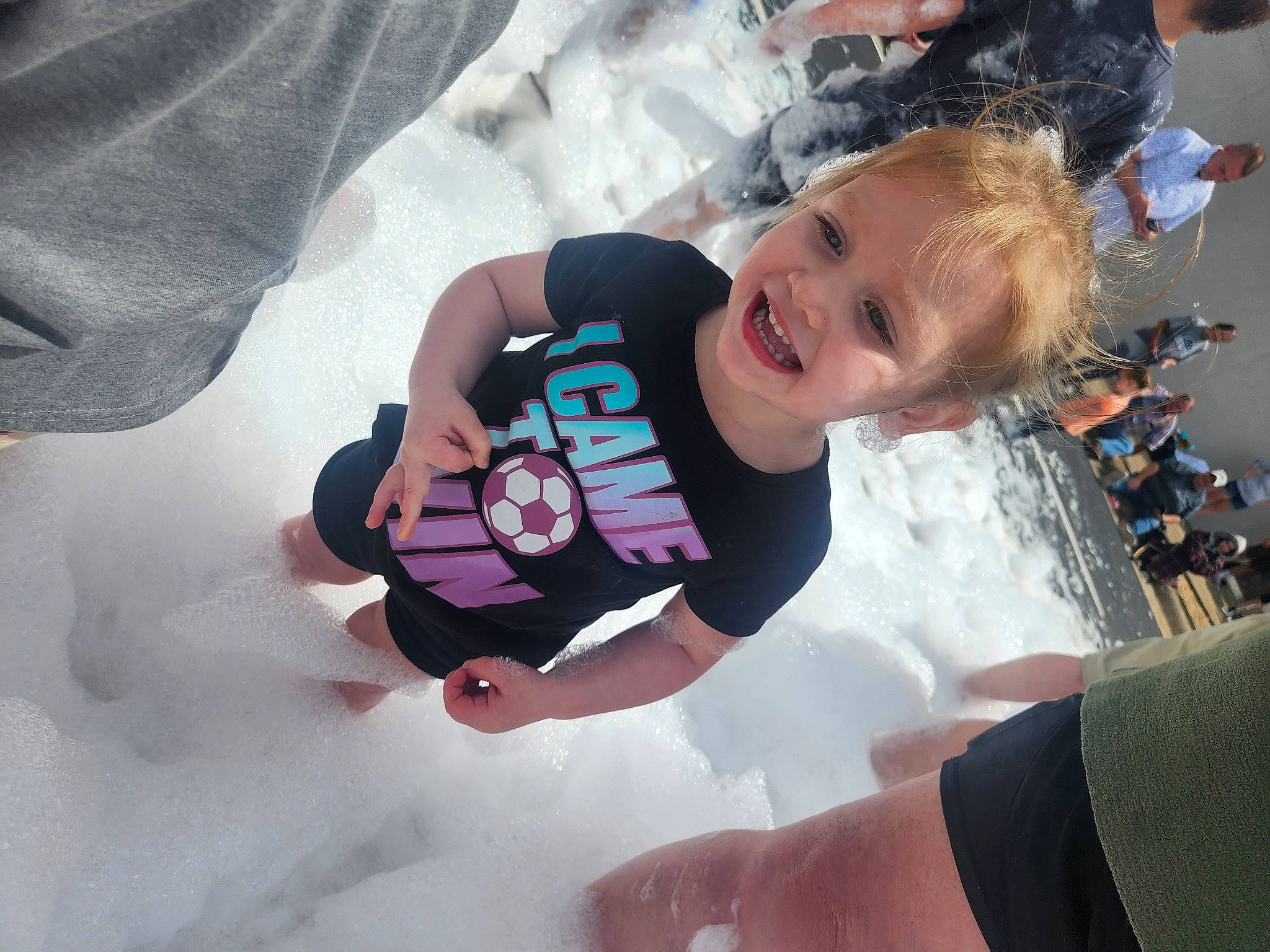 Lani is registered to the contest to win money with this photo: baby, baby_products, baby_toddler_clothing, child, event, finger, fun, gesture, happy, joy, leisure, nail, person, play, recreation, sleeve, smile, t_shirt, thumb, toddler