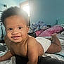 Chavezz is registered to the contest to win money with this photo: baby, smiling, diaper, bed, blanket, pillow, indoor, child, cute, happy, skin, hair, light, window, room, home, relaxed, portrait, infant, lying_down