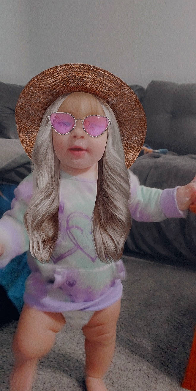 Emma joined the competition — help win amazing prizes! cap, eyewear, face, glasses, hair, hat, head, headgear, lip, mouth, neck, person, pink, purple, shoulder, sunglasses, textile, thigh, toy, vision_care
