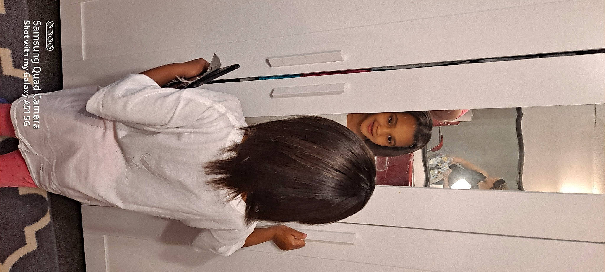 Peyton is registered to the contest to win money with this photo: automotive_design, ceiling, child, comfort, elbow, font, fun, gesture, hat, home_appliance, job, joy, kitchen, major_appliance, person, room, service, t_shirt, toddler, writing