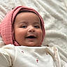Reyna is registered to the contest to win money with this photo: baby, child, smiling, face, hood, pink, white, blanket, infant, cute, portrait, happy, clothing, soft, lying_down, closeup, skin, eyes, mouth, babywear