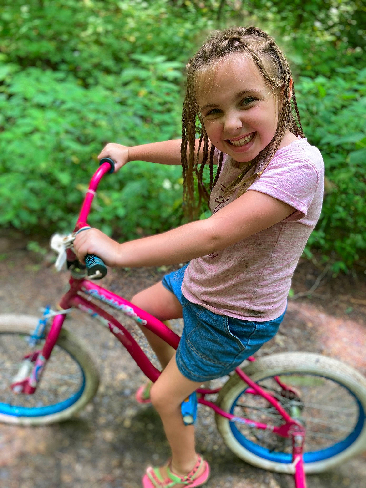 Jeannessa is registered to the contest to win money with this photo: automotive_tire, bicycle, bicycle_accessory, bicycle_fork, bicycle_frame, bicycle_handlebar, bicycle_tire, bicycle_wheel, bicycles_equipment_and_supplies, facial_expression, green, hair, hairstyle, joy, people_in_nature, person, plant, shoe, shorts, smile