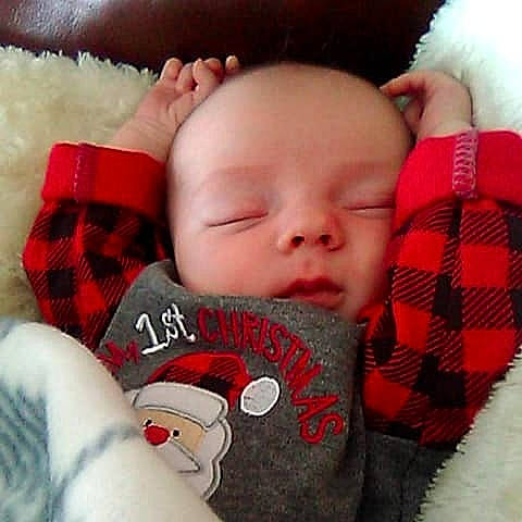 Macklin joined the competition — help win amazing prizes! bedtime, cheek, child, ear, finger, forehead, infant, lip, mouth, nap, nose, person, plaid, product, red, skin, sleep, smile, tartan, textile