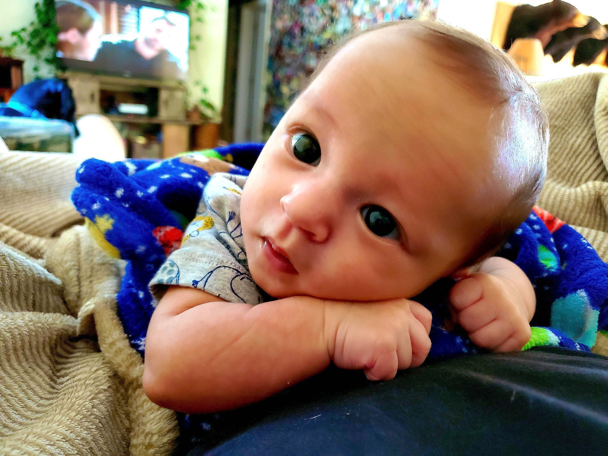 Kaison is registered to the contest to win money with this photo: baby, cheek, child, ear, eye, face, finger, head, mouth, nose, person, skin, toddler, tummy_time