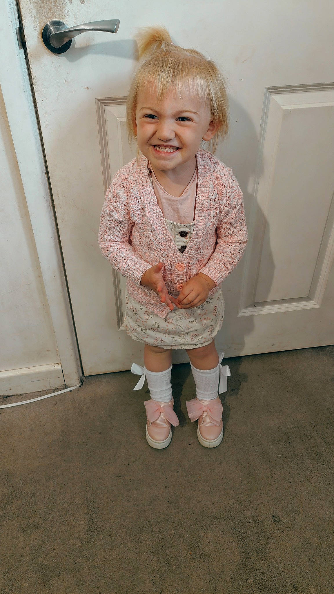 Zelda is registered to the contest to win money with this photo: baby, baby_toddler_clothing, cheek, dress, eye, face, floor, flooring, hair, hand, happy, human_body, iris, joy, knee, leg, person, skin, sleeve, smile