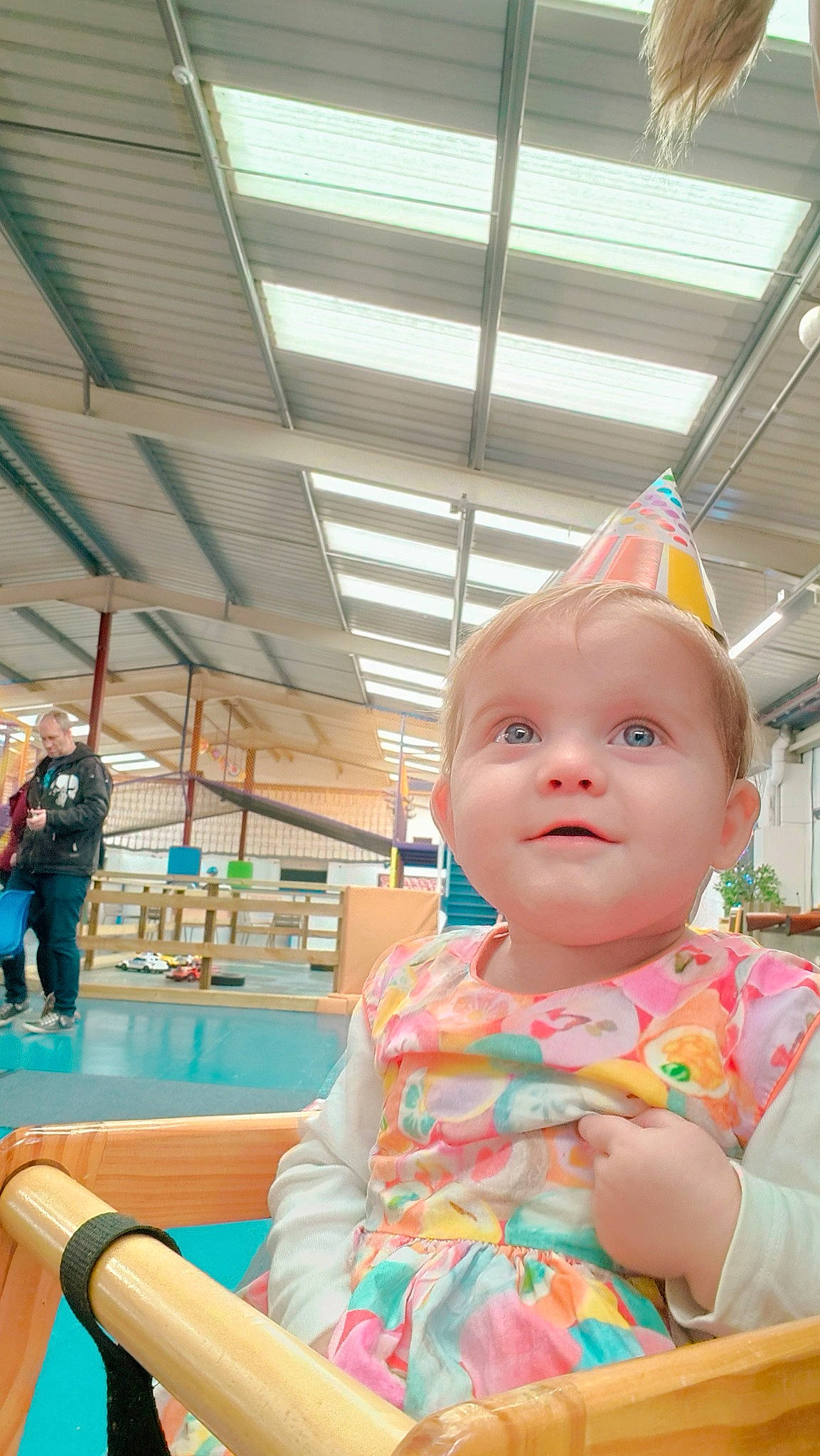 Arya is registered to the contest to win money with this photo: baby, baby_toddler_clothing, chair, child, flooring, fun, happy, hat, leisure, outdoor_play_equipment, person, play, recreation, room, sitting, toddler, vacation