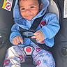 baby, child, car_seat, blue_hoodie, pajamas, spiderman, smile, happy, infant, seatbelt, cute, clothing, sitting, indoors, portrait, young_child, secure, casual_wear, face, person