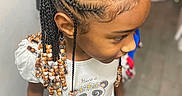 Queani joined the competition — help win amazing prizes! child, braids, beads, hairstyle, panda, shirt, patterned_pants, indoor, floor, standing, curious, young, cute, clothing, person, head, face, hair_accessory, casual, portrait