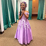 Queani joined the competition — help win amazing prizes! child, girl, dress, purple_dress, flower_crown, smiling, standing, indoors, carpet, curtains, happy, braided_hair, young, celebration, portrait, person, event, fashion, elegant, room