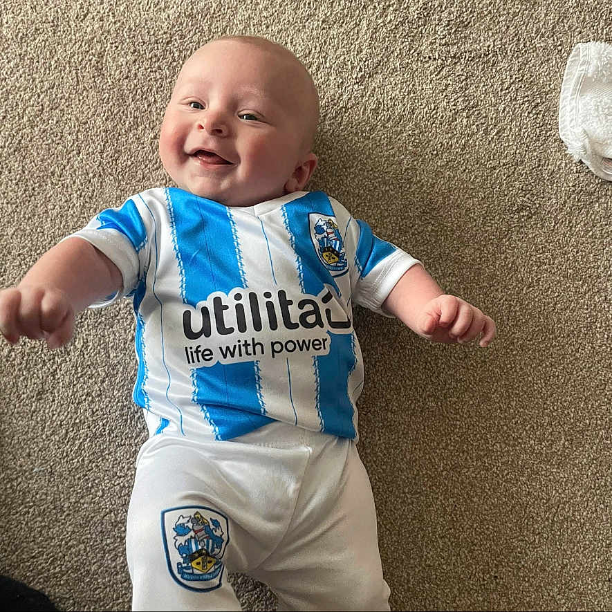 Jaxson-Daniel joined the competition — help win amazing prizes! baby, bodypart, clothing, face, finger, hand, happy, head, homedecor, laughing, newborn, pants, person, photography, portrait, shirt, shorts, sitting, smile, t_shirt