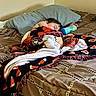 child, sleeping, bed, blanket, pillow, bottle, bedroom, indoors, cozy, nap, resting, portrait, face, hair, covered, textile, bedding, relaxed, home, quiet