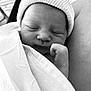 newborn, baby, infant, sleeping, hat, blanket, closeup, face, peaceful, cute, soft, black_and_white, wrapped, resting, hand, knit_hat, portrait, indoors, tender, newborn_baby