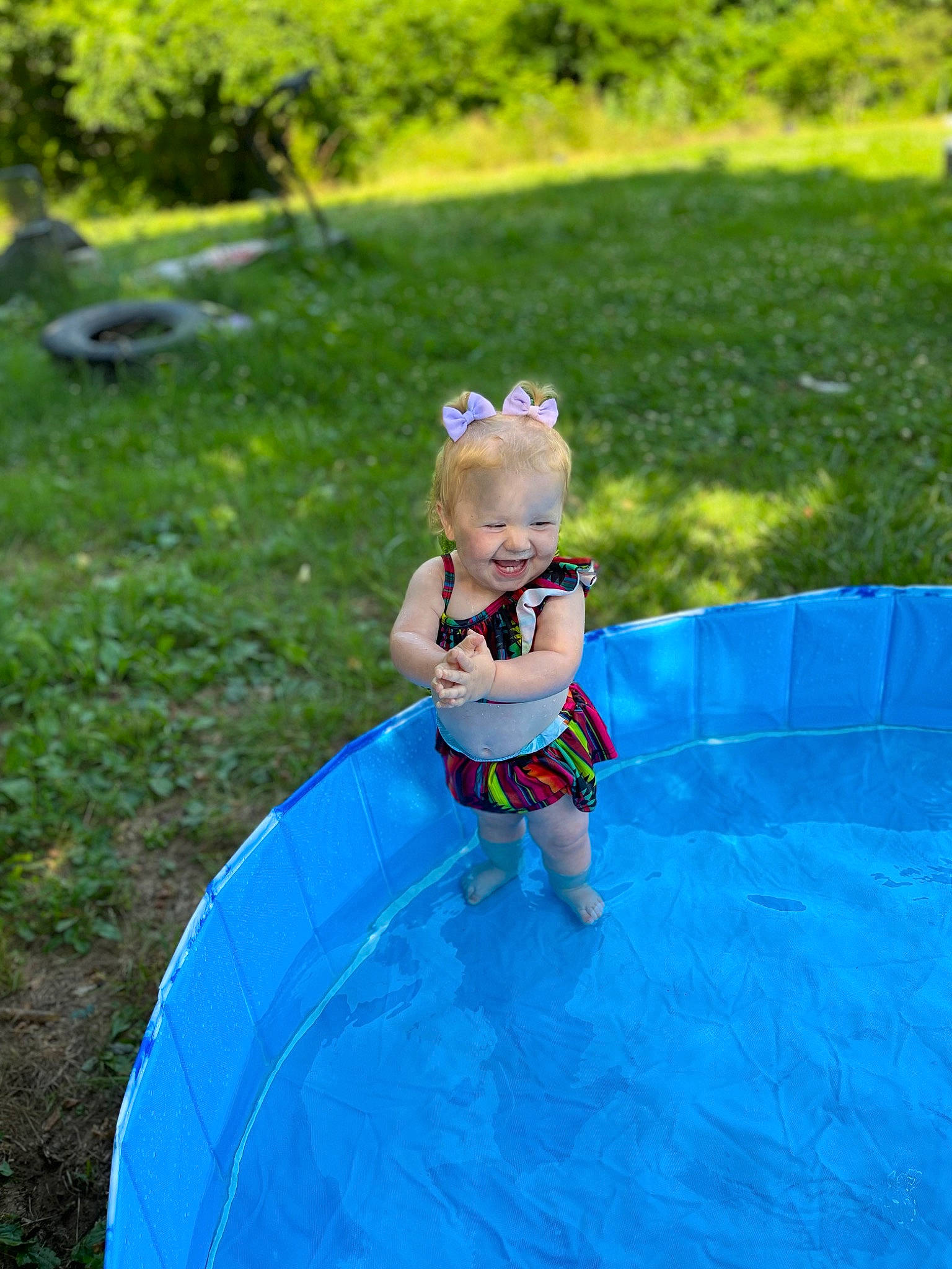 Oaklynn is registered to the contest to win money with this photo: baby, bathing, child, electric_blue, fun, games, garden, grass, happy, head, inflatable, joy, leisure, people_in_nature, person, plant, recreation, toddler, toy, vacation