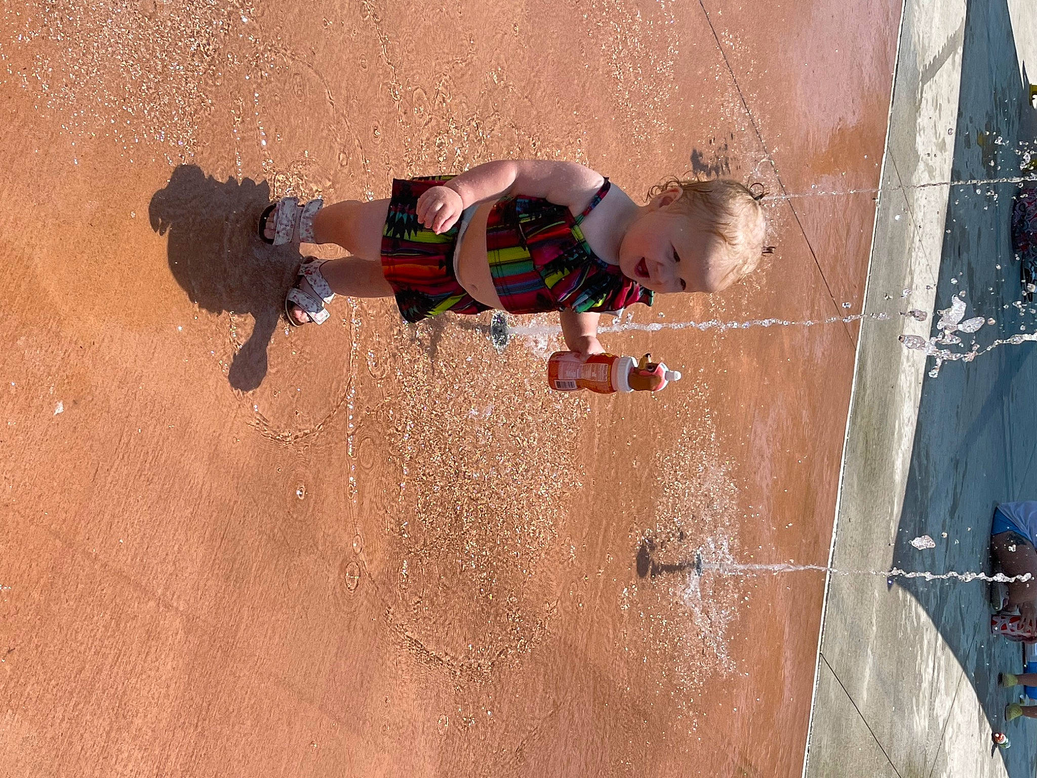 Oaklynn is registered to the contest to win money with this photo: adventure, child, competition_event, concrete, fun, hair, human_leg, landscape, leisure, person, play, recreation, sand, shadow, shorts, soil, sport_climbing, thigh, toddler, trunk