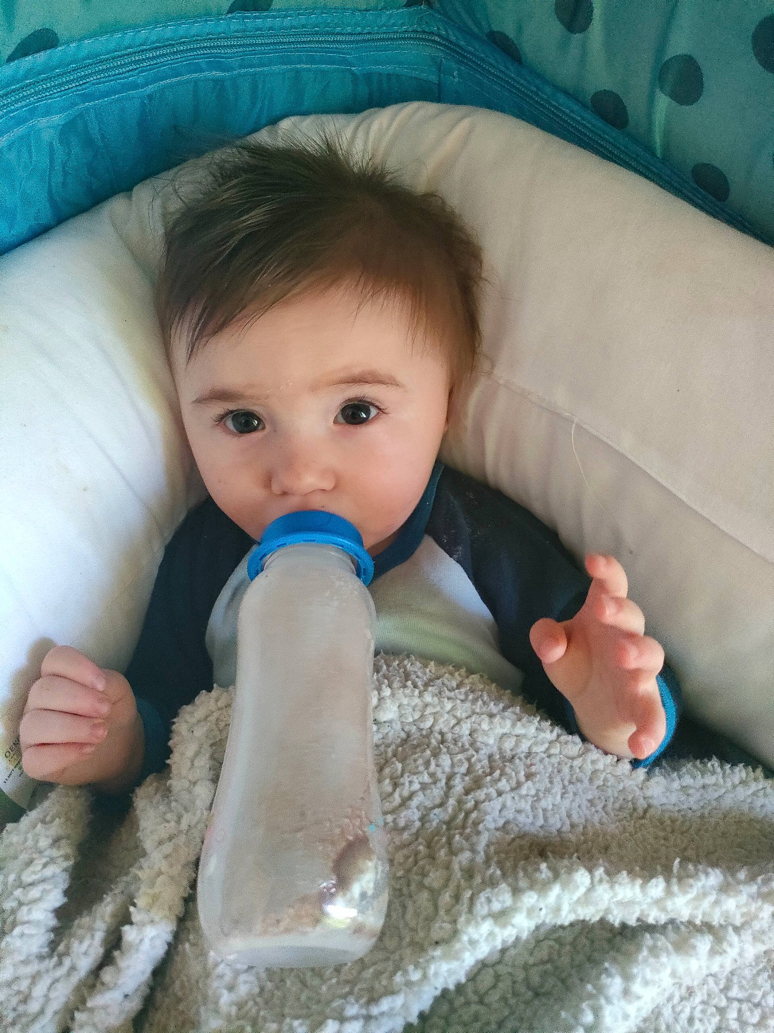 Sully participe au concours pour gagner de l'argent avec cette photo : azure, baby, blue, cheek, chin, comfort, eye, eyebrow, face, finger, gesture, hair, hairstyle, hand, head, mouth, nose, person, product, skin