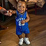 Damir joined the competition — help win amazing prizes! baby, child, smiling, blue_jersey, boston, white_sneakers, gold_necklace, gold_bracelet, hand_holding, wooden_floor, indoor, happy, person, footwear, standing, cute, portrait, clothing, skin, adult_hand