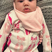 Elliani is registered to the contest to win money with this photo: baby, infant, onesie, pink_bow, headband, bib, blanket, baby_clothing, cute, portrait, indoor, child, laying_down, soft_texture, pink, white, newborn, person, face, young_child